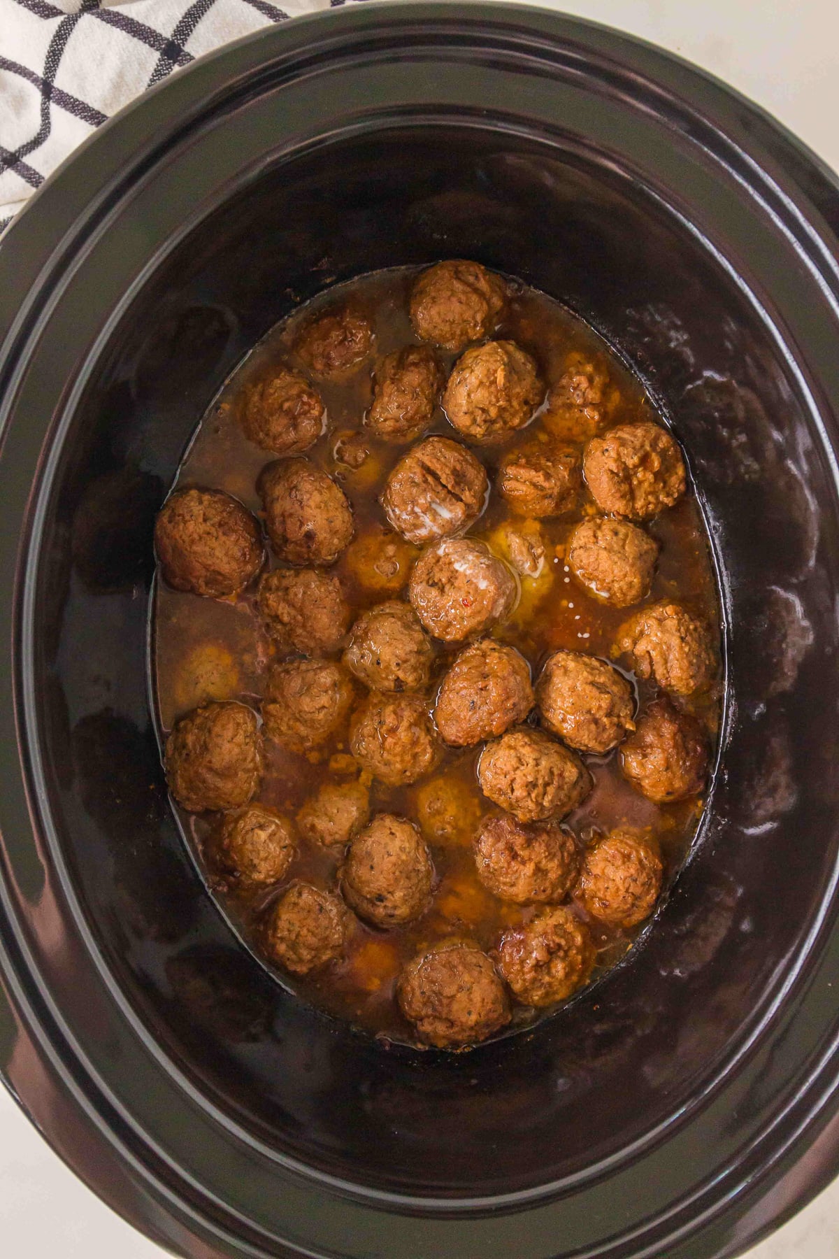 Finished dish of crockpot salisbury meatballs ready to be served.